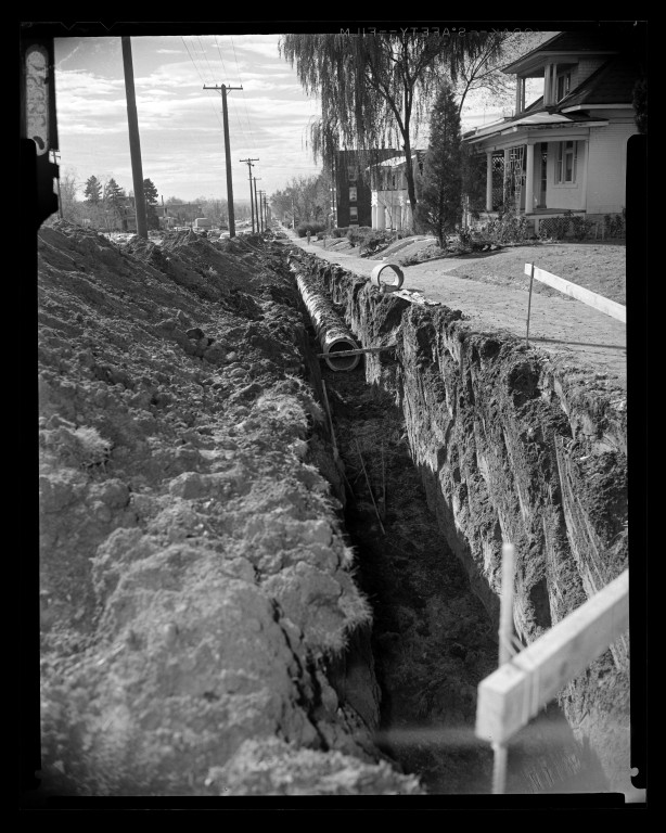 Deep utility trench along 700 East during construction in 1956